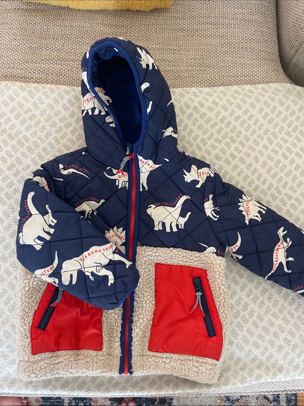 Boden Navy Quilted Kids' Jacket with Red Accents and White Dinosaur Print